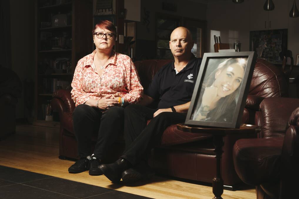 Janine Haskins, and husband Peter McLaren with a picture of Janine's daughter Brontë Haskins who took her own life while receiving care from ACT Health. Picture: Dion Georgopoulos