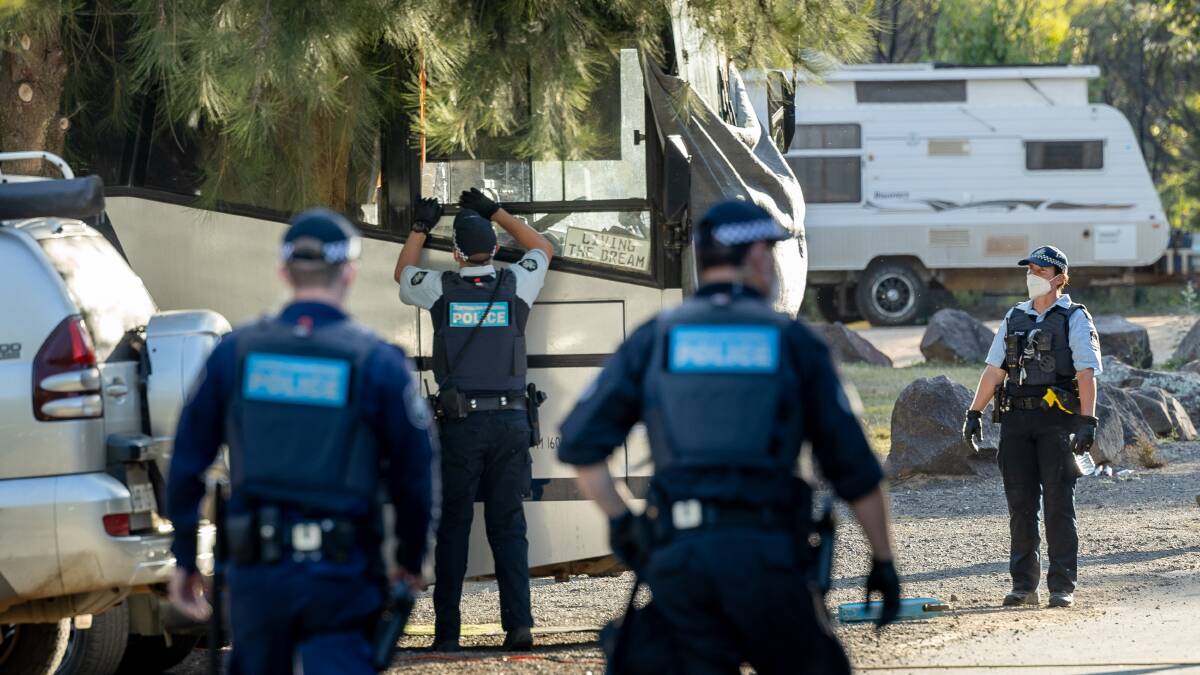 Police arrive at Cotter Campground in numbers on Monday evening to clear Convoy to Canberra protesters who were camping without a booking. Picture: Sitthixay Ditthavong