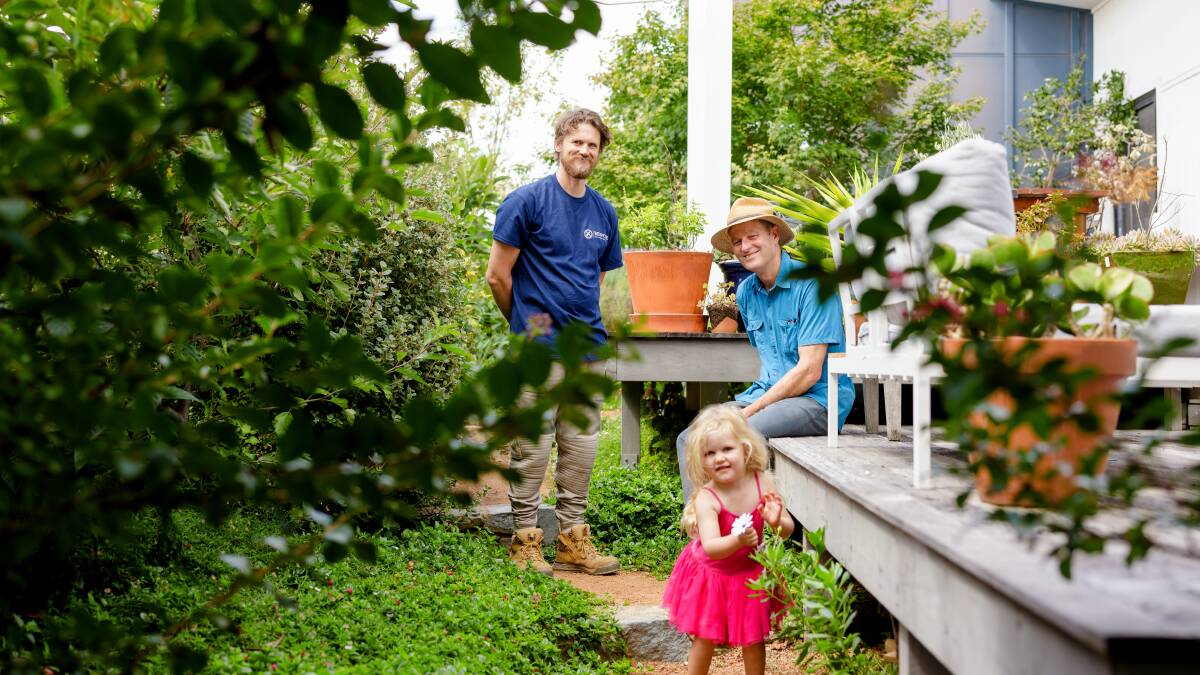 Luke and Isobel Dickerson with Tim Edmondson in the thriving Coombs garden they planted in 2015. Picture: Sitthixay Ditthavong