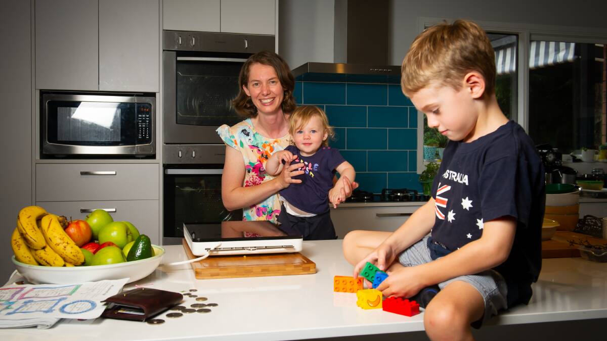 Kristy Bartlett, pictured with her children Skye and Ryan, made the switch from gas heating with plans to replace the gas cooktop in the future. Picture by Elesa Kurtz