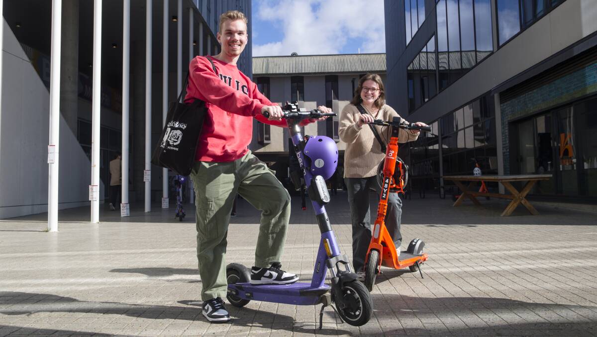 Australian National University students Sebastian Adams and Juliette Webster ahead of the scooter expansion announcement this week. Picture: Keegan Carroll