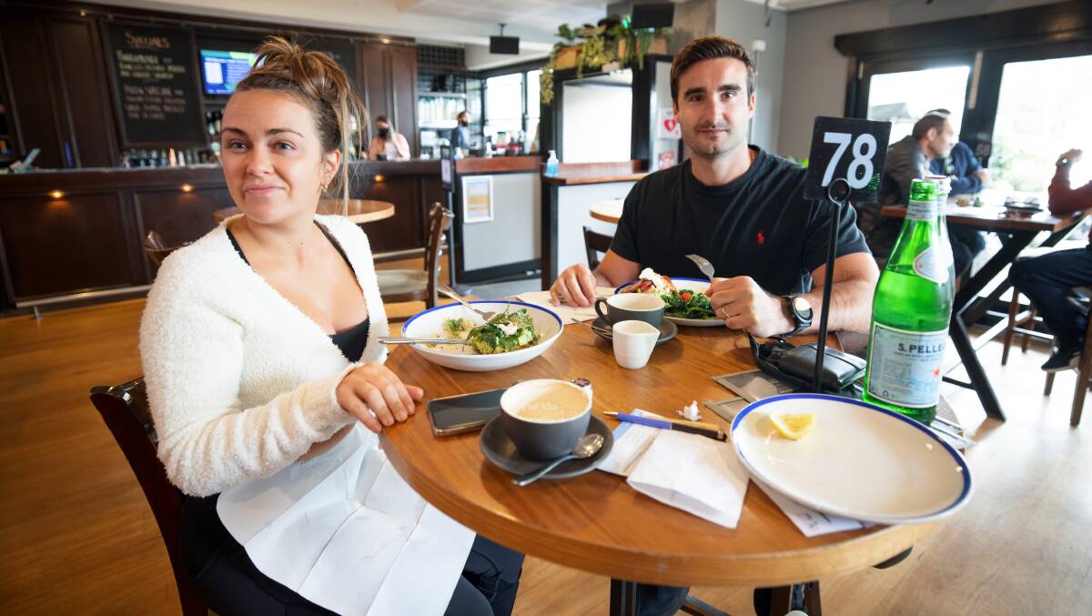 Emily and Ricky Cole had a morning breakfast date at Edgar's before heading back to Campbell to welcome dine-in customers to their businesses, Department of Pizza, for the first time in months. Picture: Sitthixay Ditthavong