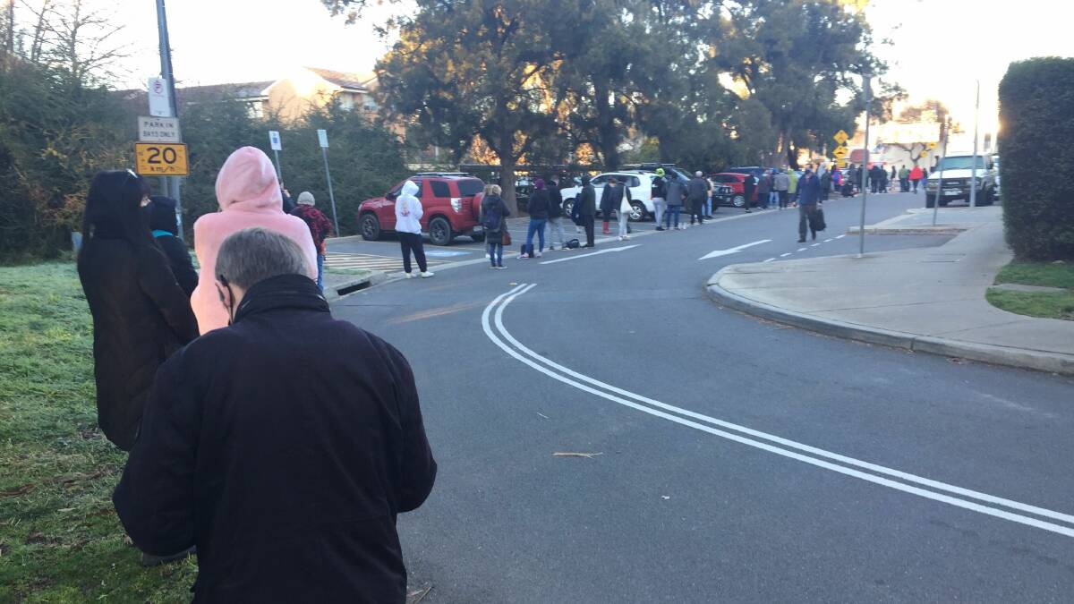 Long queues formed at the O'Connor testing site before it opened on Wednesday. Picture: Scott Hannaford