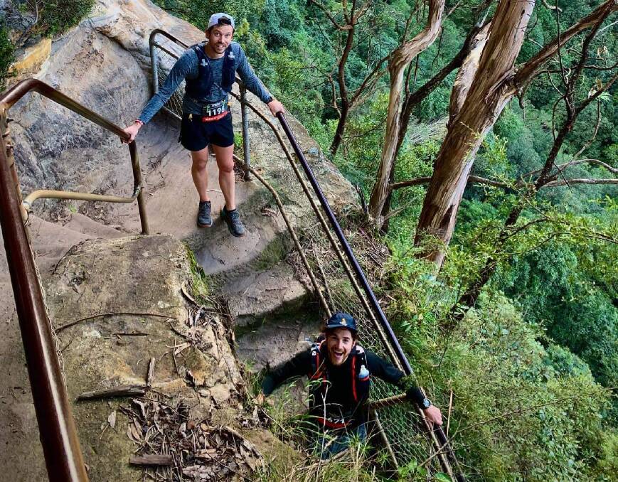 Adam Kittely and Tom Cumming descend one set of the thousands of stairs the 100-kilometre trail takes in. Picture: Supplied.