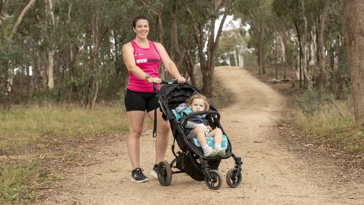 ACT Mum Runner coordinator Hayley Cuttle with her two-year-old son Lachlan. Picture: Keegan Carroll