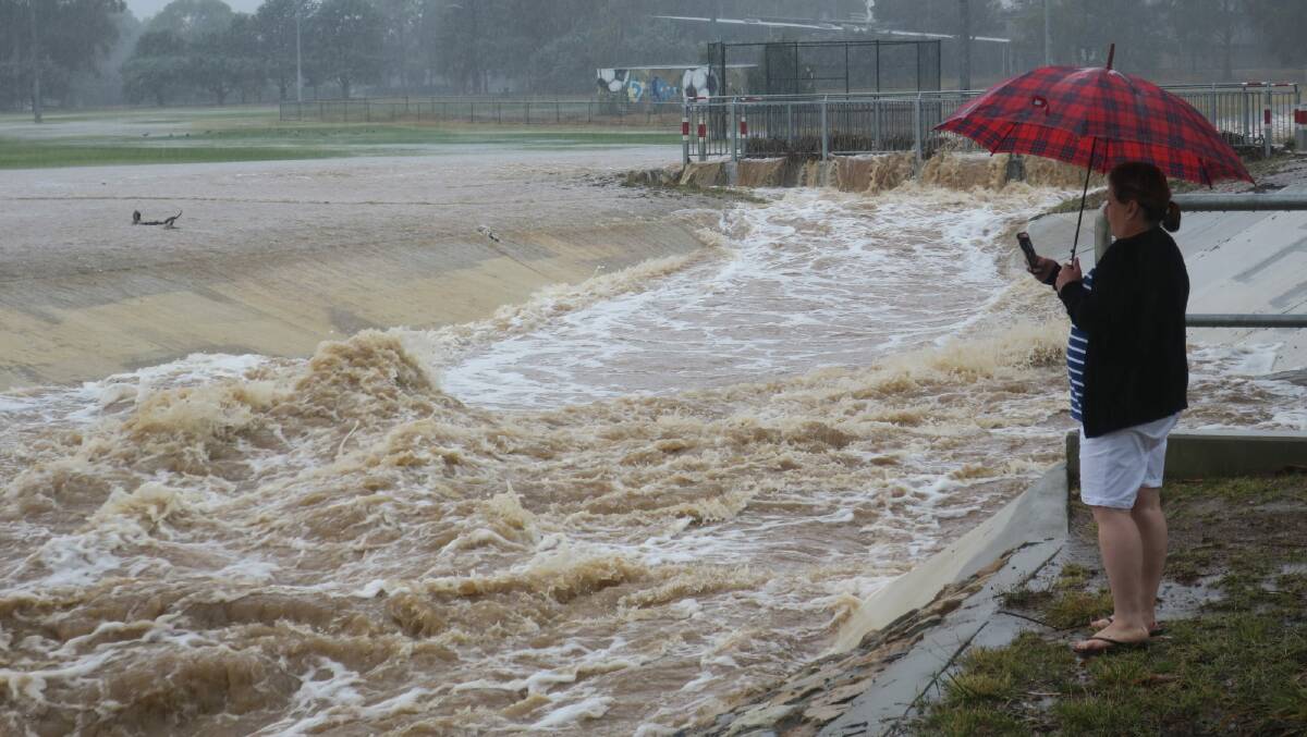 A storm water drain near Dickson Oval overflowed during the 2018 floods. Picture by Scott Hannaford 
