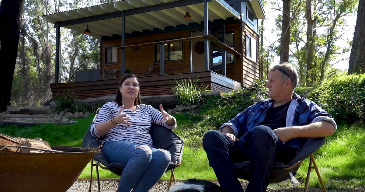 Karen and Brian Bennett at their tiny home when it was operating as an Airbnb.
