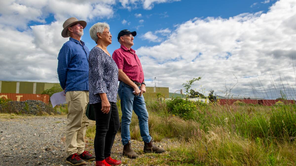 Goulburn residents Peter Tapp, Sue Chang and Geoff Godfrey have pitched in for the Goulburn solar project. Picture by Elesa Kurtz