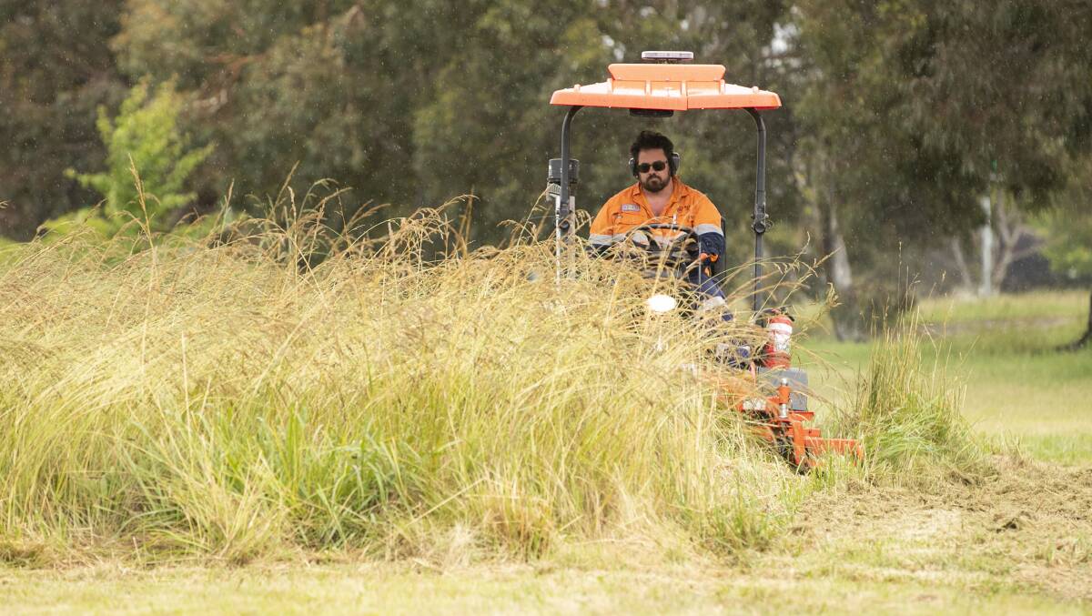 John Corby at City Services' Nicholls depot. The ACT government has put on extra mowing services this season to contend with the rapid growth of grass. Picture: Keegan Carroll
