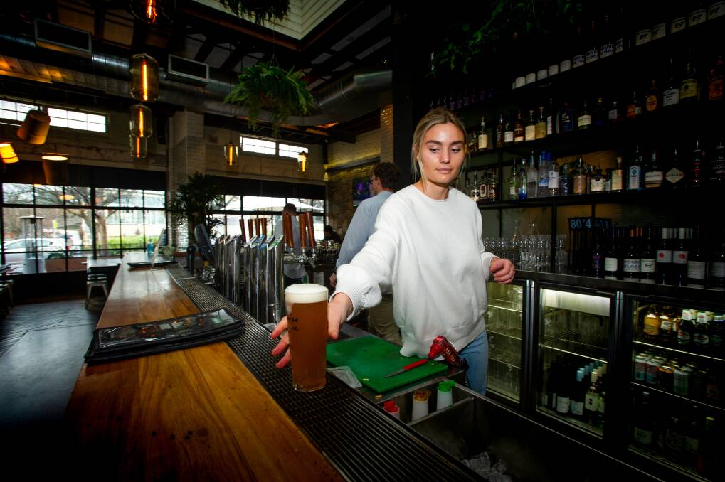 Public Bar staff member Maddie McDonald has seen business slow up as states shut down. Picture: Elesa Kurtz 
