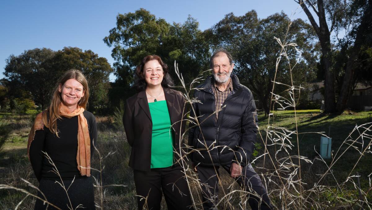 Landcare's Karissa Preuss (left) and John Giacon (right), with ACT Greens member Jo Clay (centre), who will move to protect urban land care plantings from mowing. Picture: Sitthixay Ditthavong