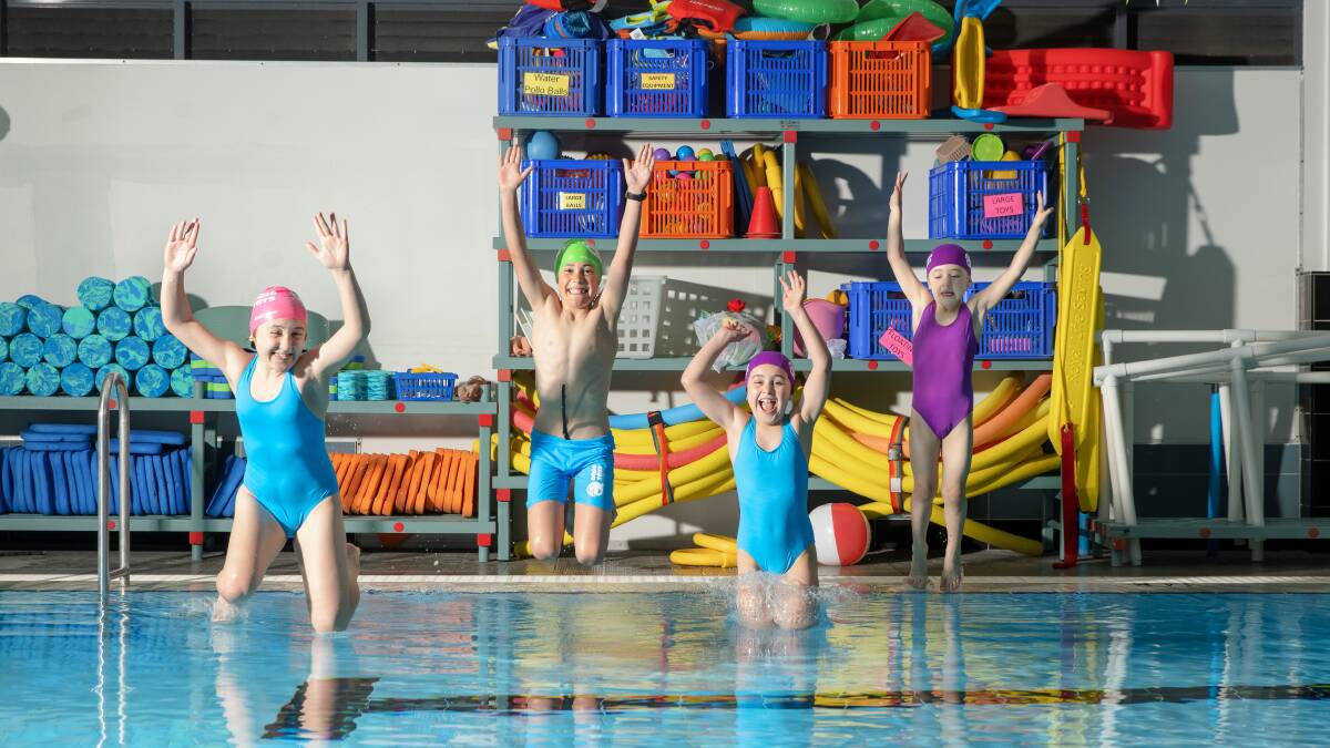 Young swimmers Carla Sarri, 10, Arli Willey, 9, Milly Sarri, 8, and Evie Sarri, 6, will be allowed back in the pool for regular lessons at Aquatots from next week. Picture: Sitthixay Ditthavong