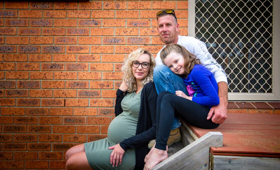 Sarah Cragg with partner Steve Howarth and step-daughter Kasey Howarth is expecting their baby on Easter Sunday. Picture: Supplied