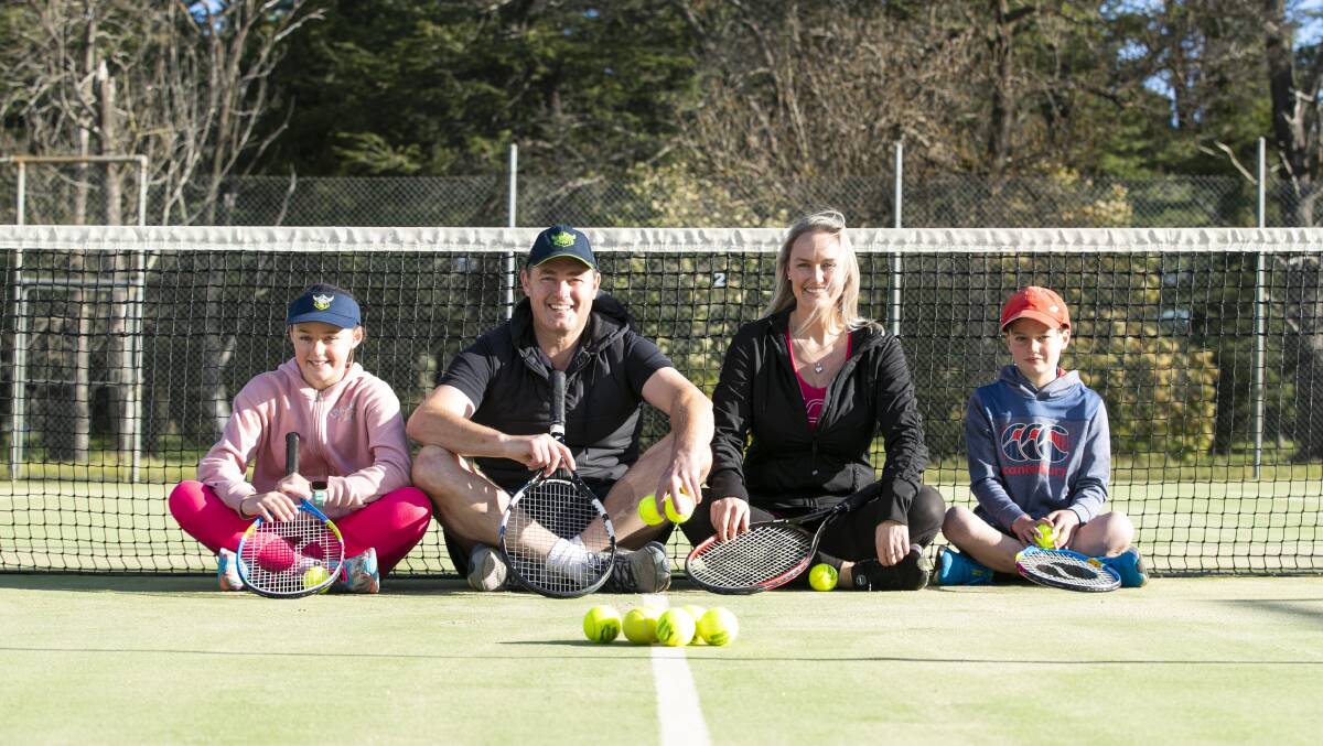 Madeleine, 10, Michael, Josie and Hugo Radnedge, 8, were one of the first families on the court at Turner Tennis Club following a slight relaxation of lockdown rules this weekend. Picture: Keegan Carroll