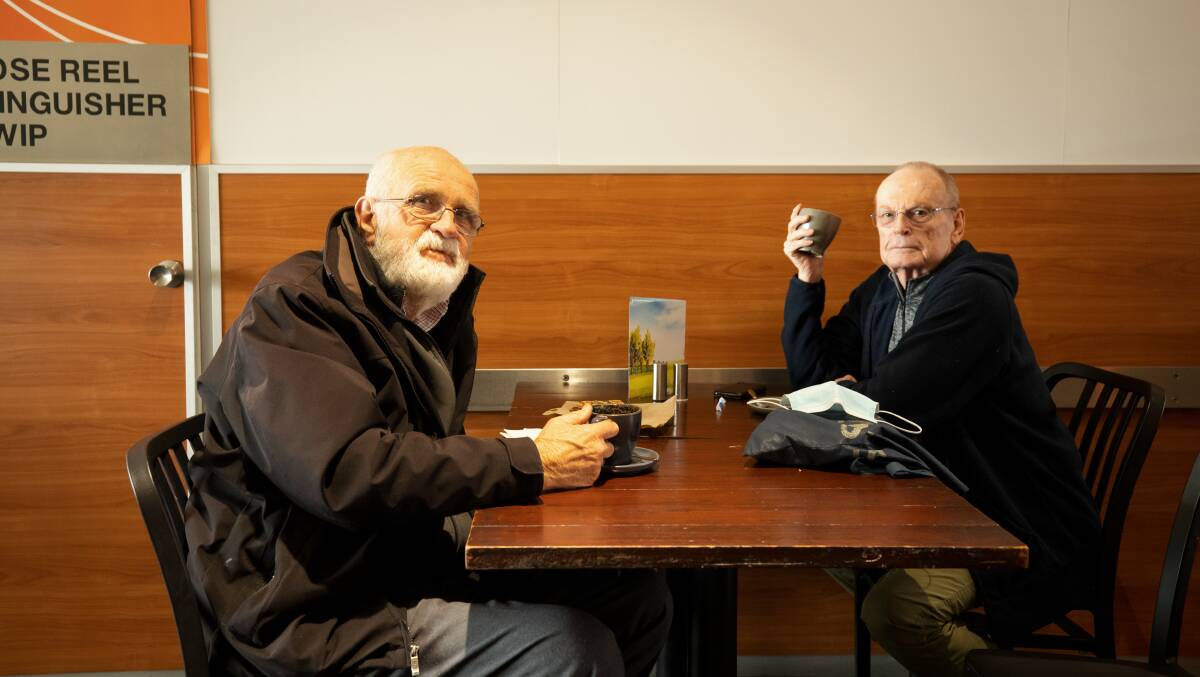 Bob Kibble and John Vaughan shared the first coffee together in months at Belconnen Mall's High Cafe on Friday afternoon. Picture: Sitthixay Ditthavong