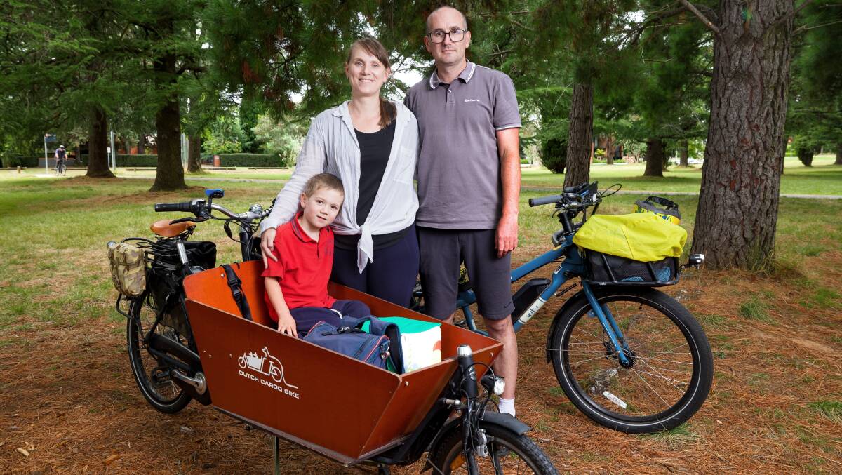 Sharon and Adam Gray do most of their travel, with five-year-old son William, using two cargo e-bikes. Picture by Sitthixay Ditthavong