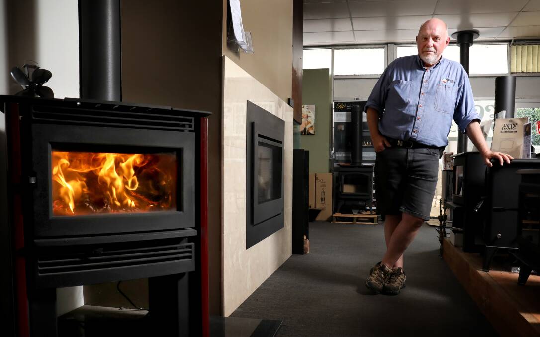 John Schmitzer says wood fired heaters have become increasingly popular with customers at his store, Heating and Cooling Services in Fyshwick. Picture by James Croucher
