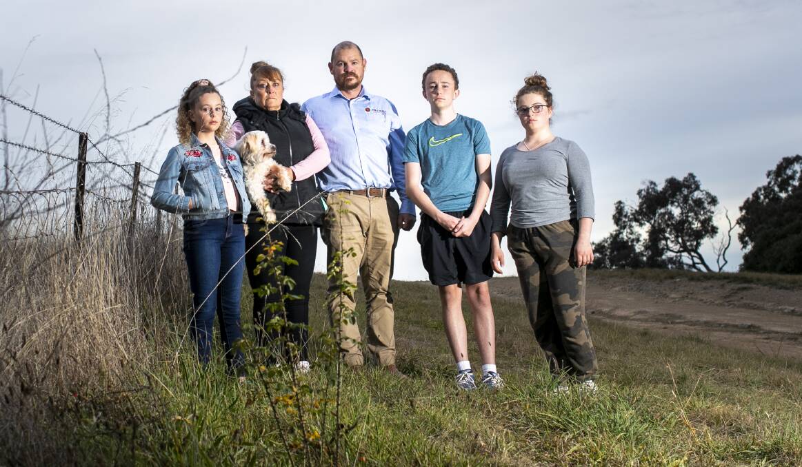 After moving away from a quarry in south Royalla, Grace, Kylie, Kieran, Harrison and Abbey Hynes have been notified of a proposal to build a new quarry next door. Picture: Keegan Carroll