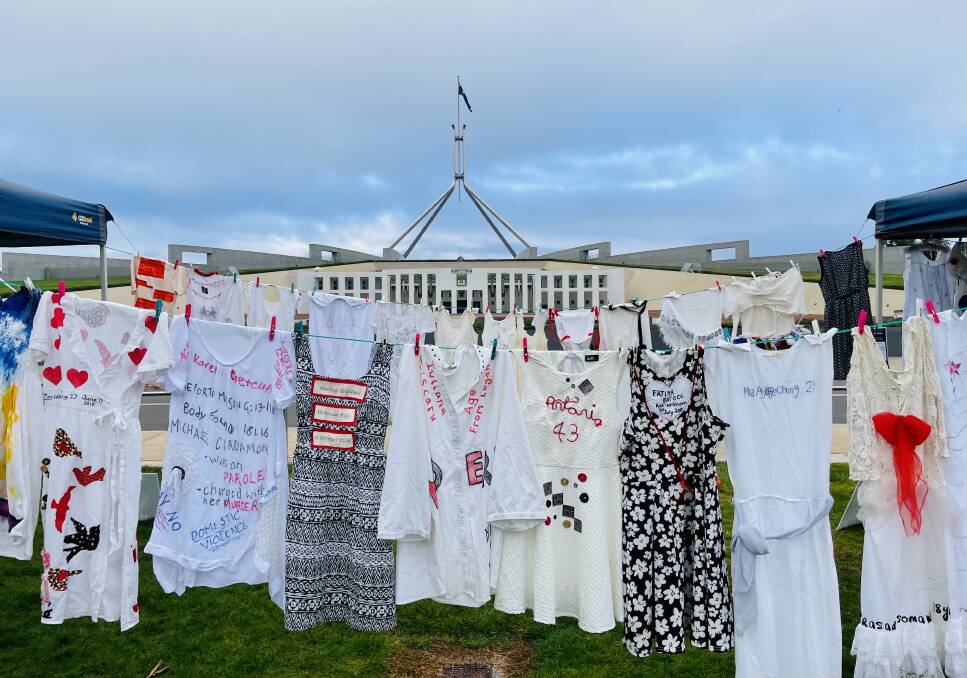 150 dresses have been hung outside Parliament House this morning, representing the women who have killed in domestic violence incidents this year. Picture: Supplied