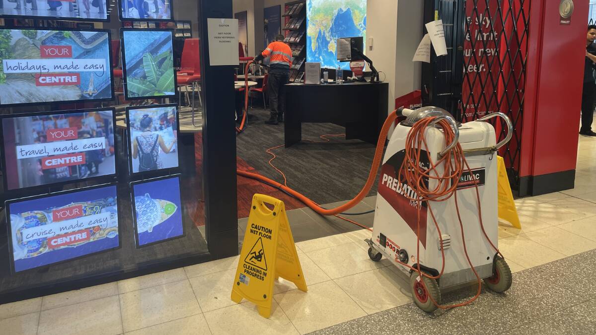 Several shops at the Canberra Centre underwent clean-up efforts on Thursday. Picture by Alex Crowe