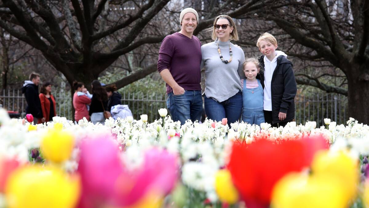 Andrew, Cobi, Sarah and Will Heibl, from Casey, were enjoying showing family around Canberra's favourite flower festival. Picture by James Croucher