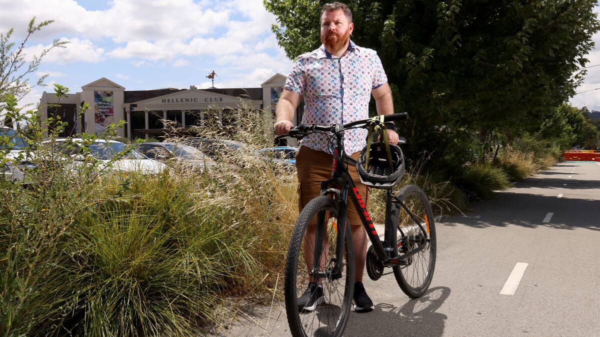 Pedal Power ACT Executive Director Simon Copland on the bikeway outside the Hellenic club in Woden which the club plans to move as part of their new development proposal. Picture by James Croucher