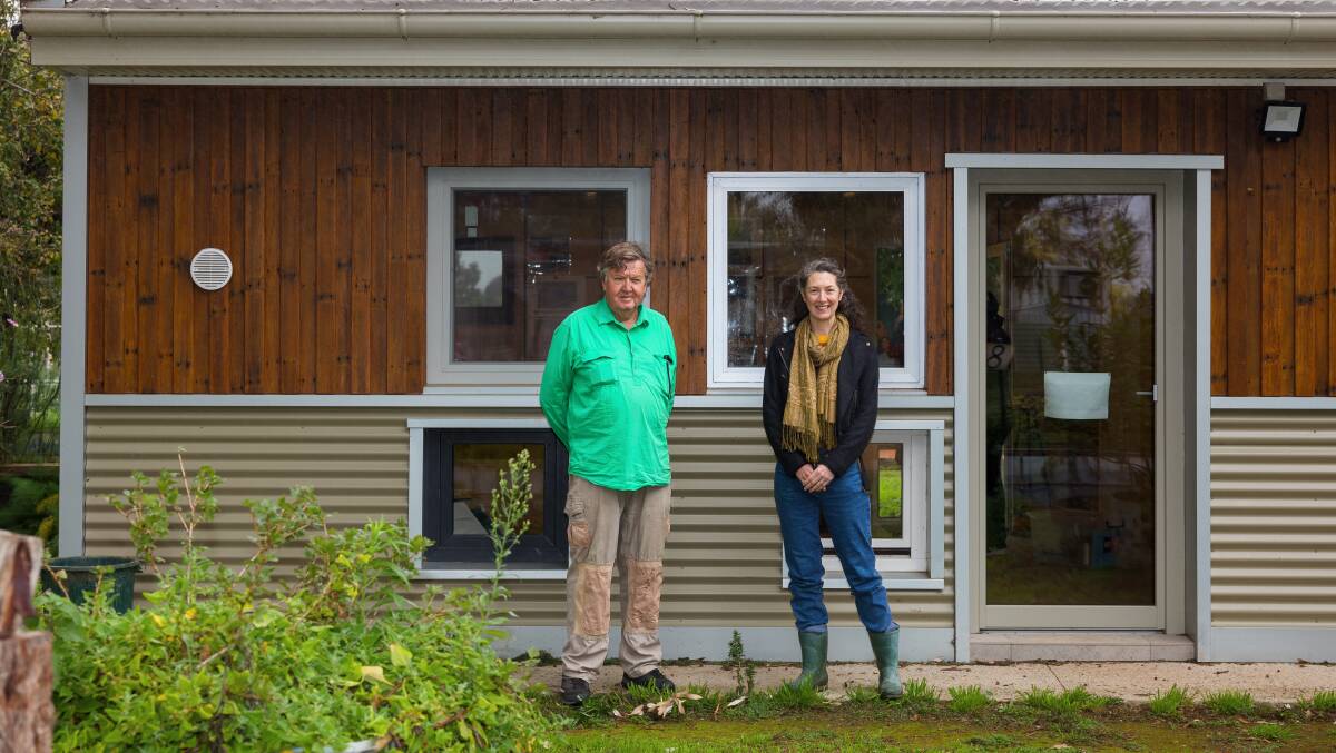 John Peters and Brook Clinton outside the shed SEE-Change helped build at Canberra City Farm through a sustainability grant program. Picture: Sitthixay Ditthavong