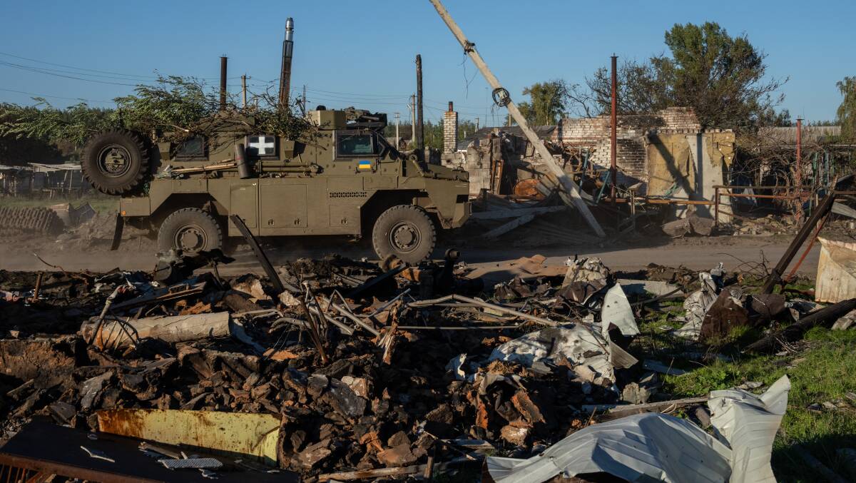 An Australian-built Bushmaster in Lozove, Ukraine, a village destroyed by missile attacks. Picture Getty Images
