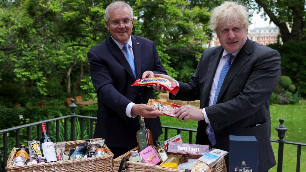  "The deal is done" - Scott Morrison and Boris Johnson exchange local delicacies, including Canberra's own Bentspoke beer. Picture: Twitter