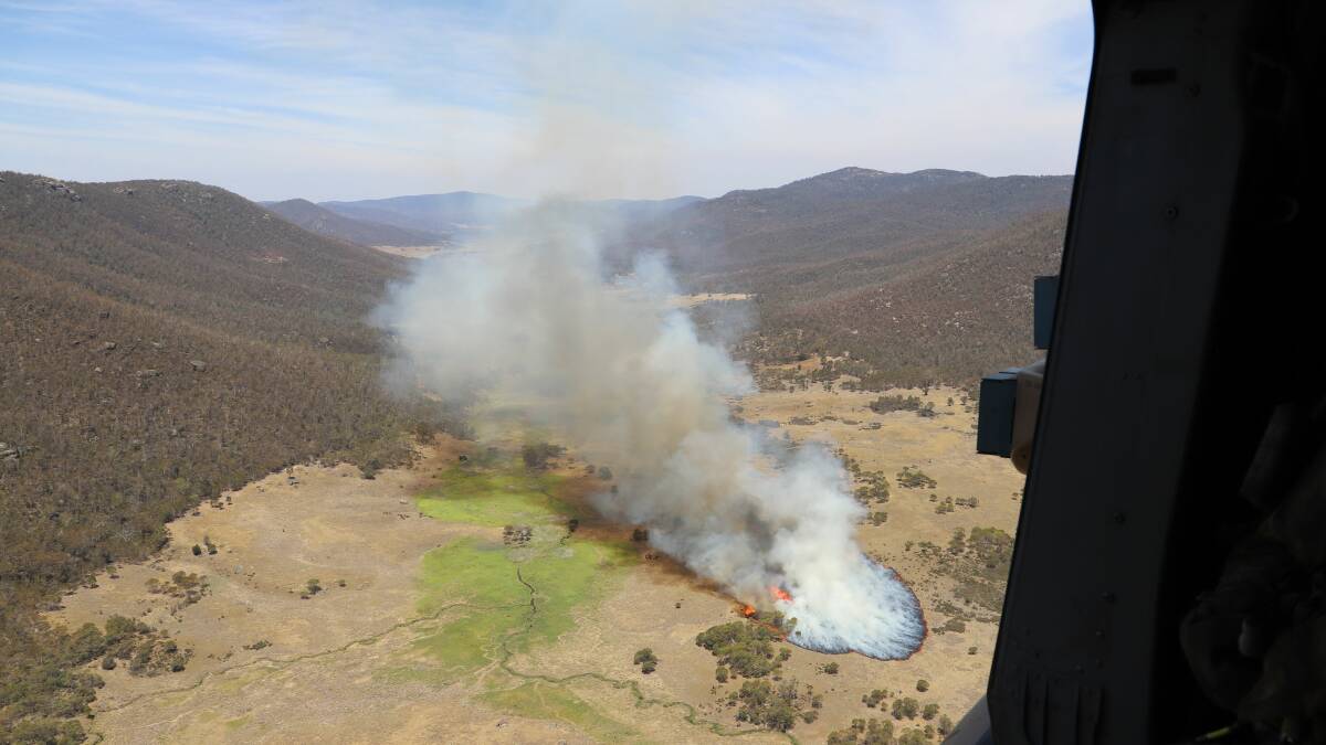 The Australian Defence Force has released photos of the helicopter which accidentally sparked the Orroral Valley fire. Pictures: ADF