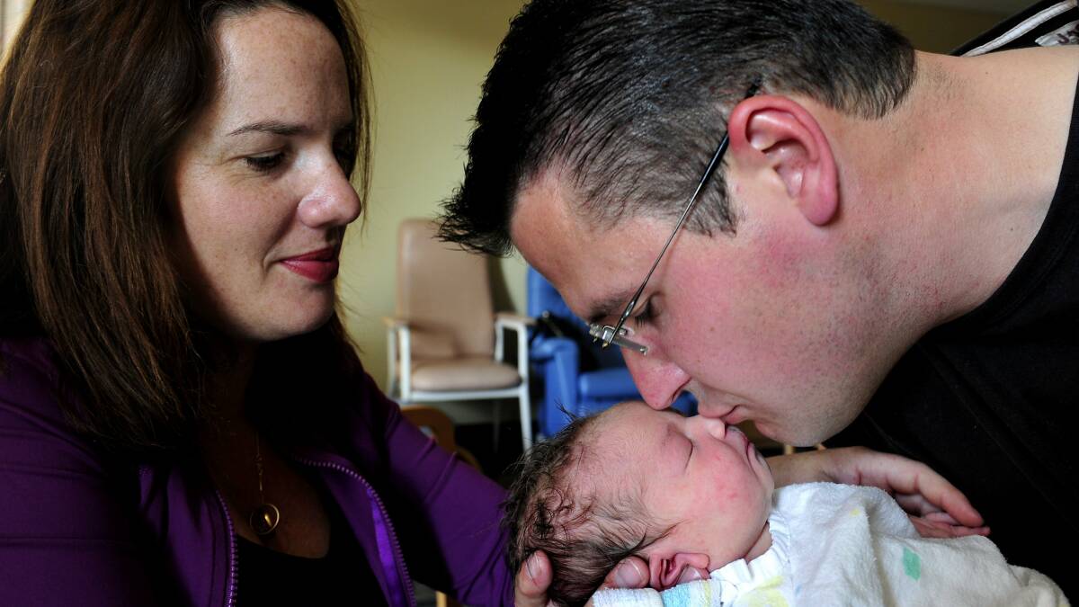 Zed Seselja and wife Ros welcomed the addition to their family of baby Grace Seselja in 2013. Picture: Melissa Adams