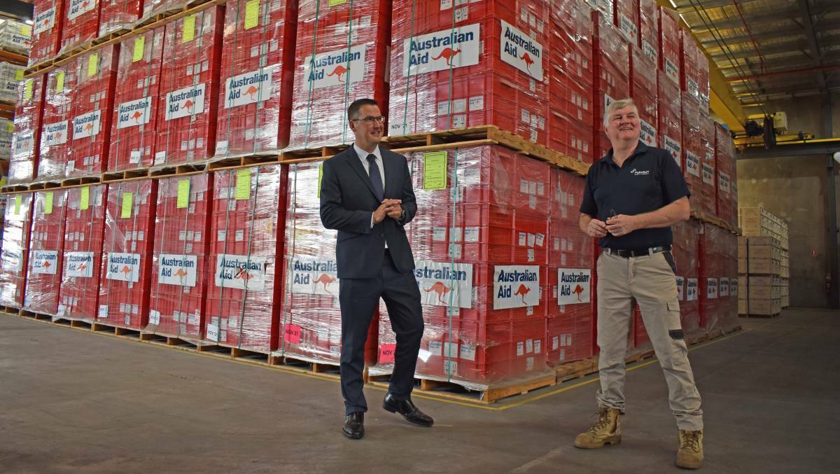 Zed Seselja with warehouse manager John Wallerstein at Australia's humanitarian supplies warehouse in Brisbane. Picture: Supplied
