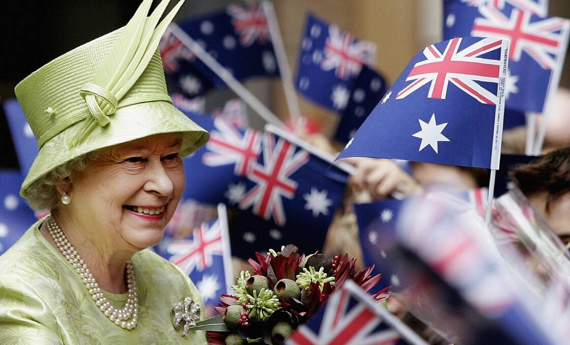 Queen Elizabeth ll smiles amongst Australian flags being waved by the crowd after the Commonwealth Day Service March in 2006. Picture: Getty Images