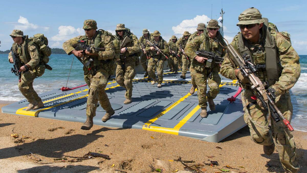 Australian Army soldiers conduct an amphibious beach landing Cowley Beach near Townsville. Picture: Defence