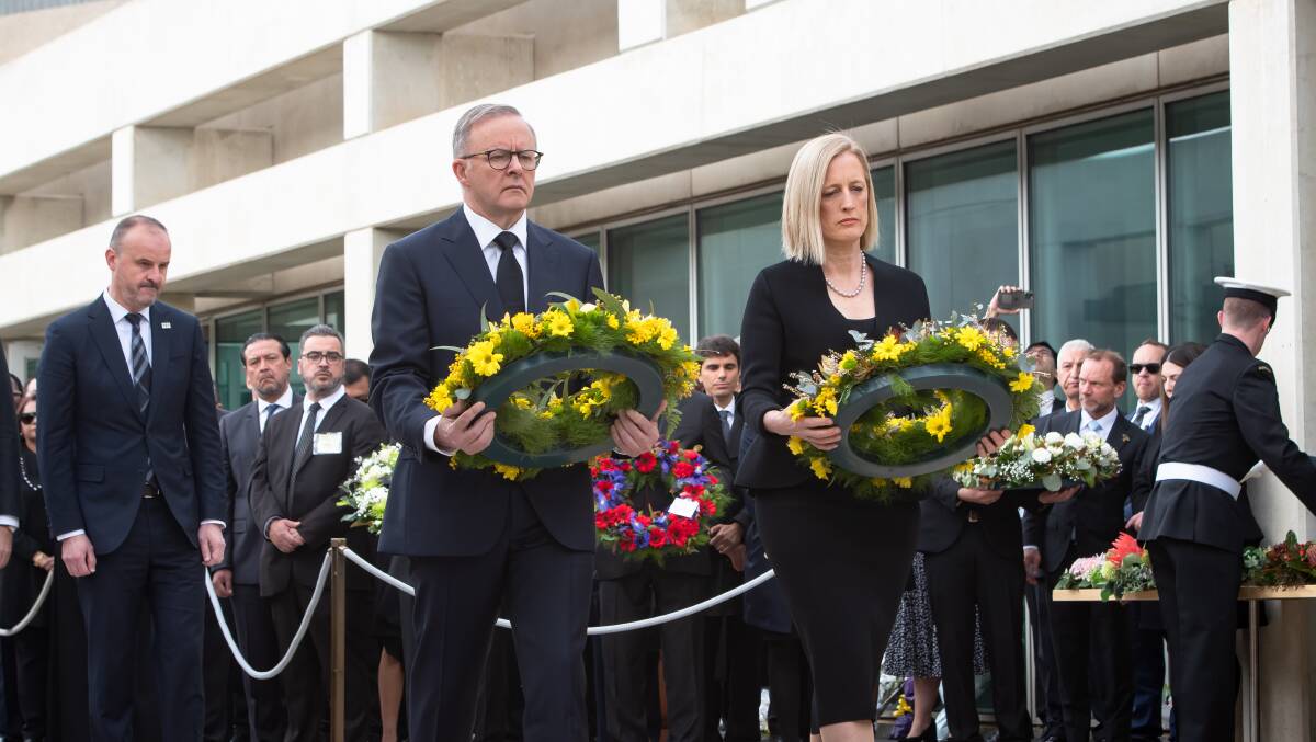 Anthony Albanese Katy Gallgher lay a wreath for the Queen. Picture by Elesa Kurtz