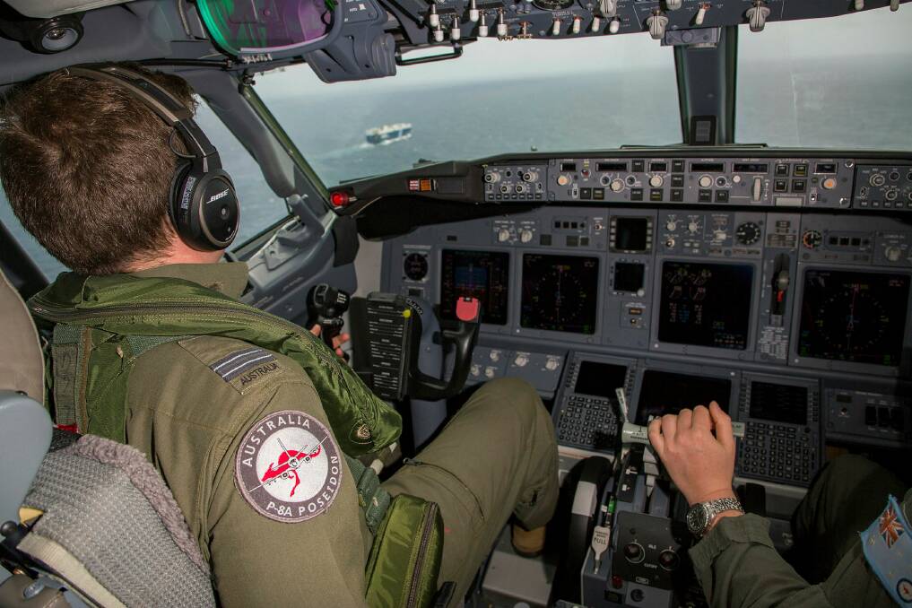 A P-8A flies by to identify an unknown vessel. Picture: Department of Defence