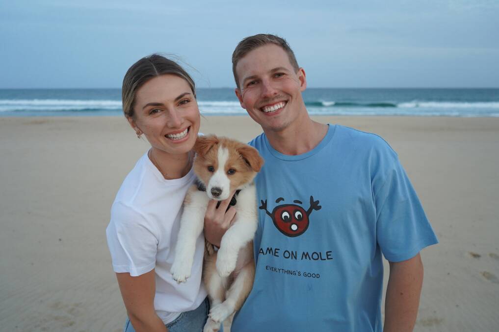 HAPPY AND HEALTHY: Oceana Strachan with her fiance Conor Hegyi and puppy Luna. Pictures: Supplied