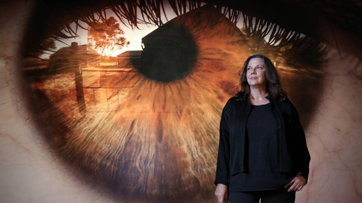 Curator Hetti Perkins with an artwork by Dylan River titled Untitled (Bungalow). Picture: James Croucher