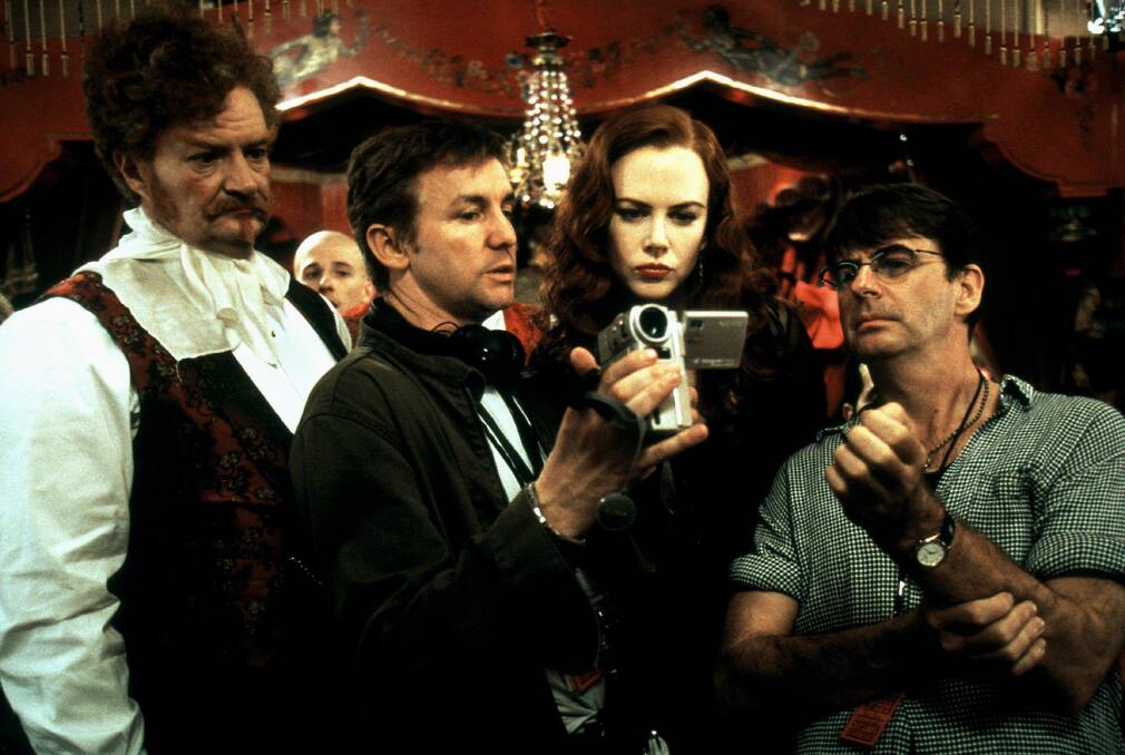 Behind the scenes of Baz Luhrman's Moulin Rouge! with Jim Broadbent (left) and Nicole Kidman (second from the right). Picture: Allstar Picture Library Ltd./Alamy Stock