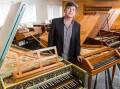 School of Music deputy head Scott Davie with some of the ANU's historical instruments. Picture: Florence Nicol
