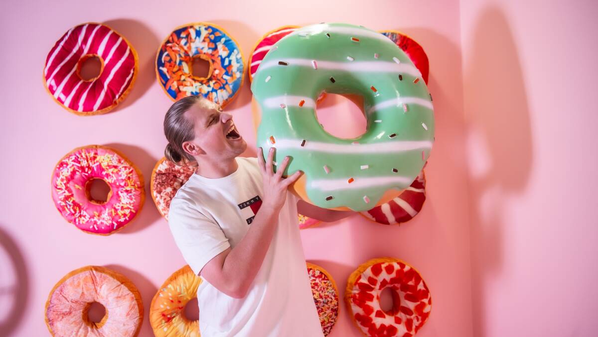 Bradley Olivera in Selfie Museum's doughnut-themed installation. Picture: Karleen Minney
