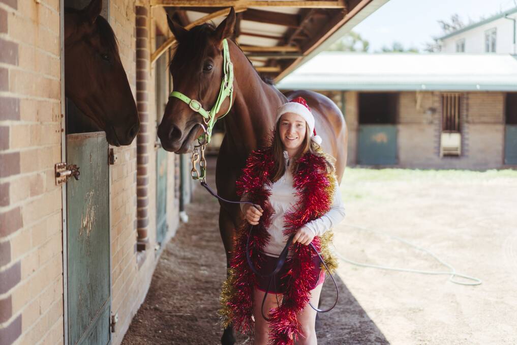 Apprentice jockey Ellen Hennessy, with horse Kiss My Swiss at the Queanbeyan stables. Picture: Dion Georgopoulos 