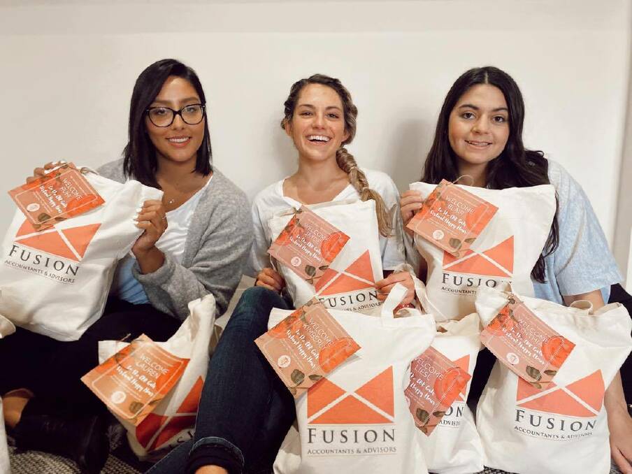 Rae Knopik, centre, with CBR Gals Network members ready to hand-deliver the goody bags for Saturday's virutal happy hour. Picture: Supplied. 