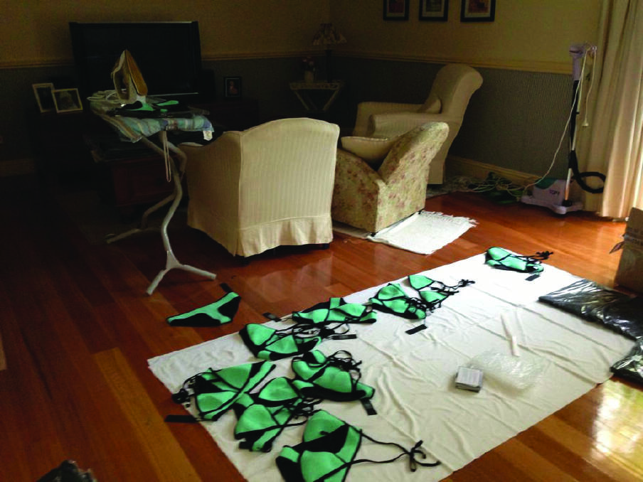 The living room of Erin Deering's family home in January 2013. She spent three days ironing flat every single neoprene bikini that arrived from China completely squashed. Picture supplied