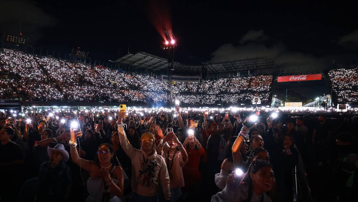 Fans with their phone torches during Marjorie, as a tribute to Taylor Swift grandmother, Marjorie Finlay. Picture Getty Images/TAS Management