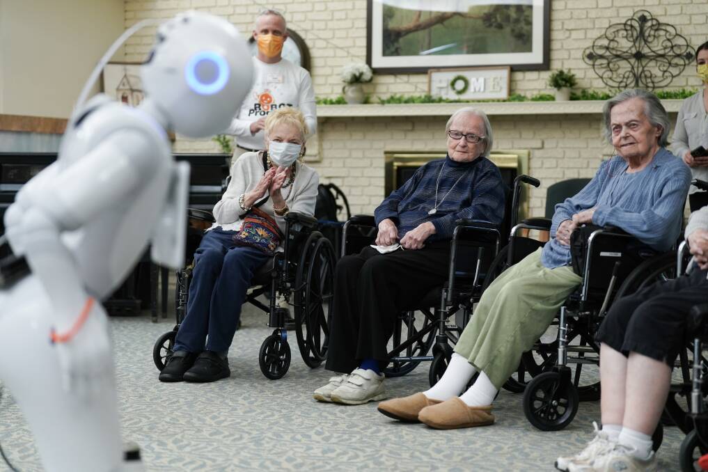 Nursing home residents entertained by the robot assistant Pepper. Picture Getty Images