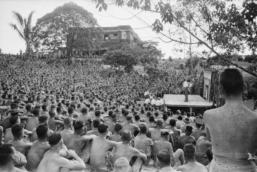A large crowd is entertained by a concert party at Changi. Picture Australian War Memorial, P03821.015