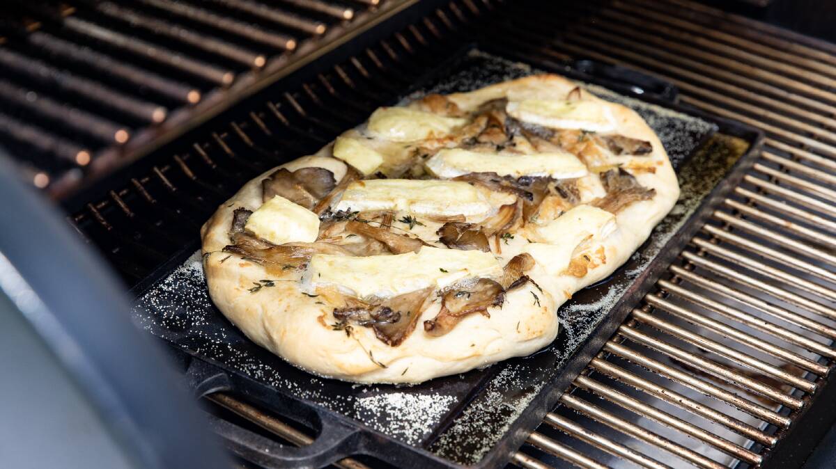 Cheesy confit garlic and mushroom pizza. Picture: Supplied