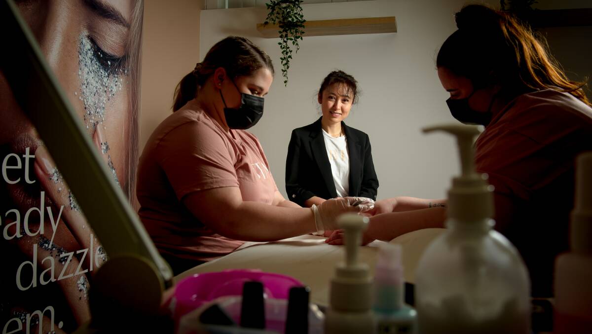 Australian Beauty Therapy Academy principal Ping Gan (centre) with trainer Renae Galvin and Chloe Harlow. Picture: Elesa Kurtz