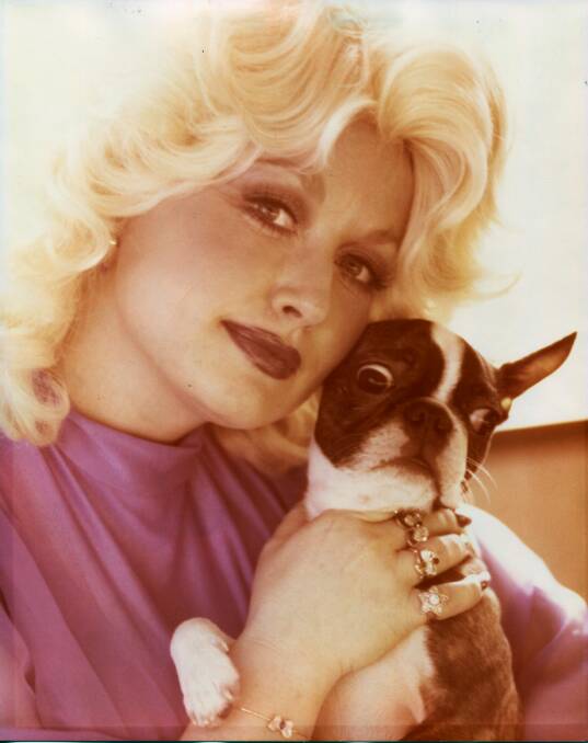 Parton with her late dog Popeye. Picture From Songteller, by Dolly Parton